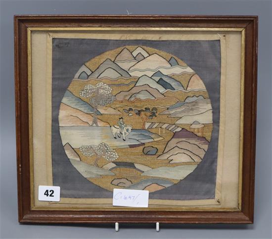 A Chinese kesi woven roundel, in gilt and polychrome thread of a figure in a mountainous landscape on horseback 24 x 26cm